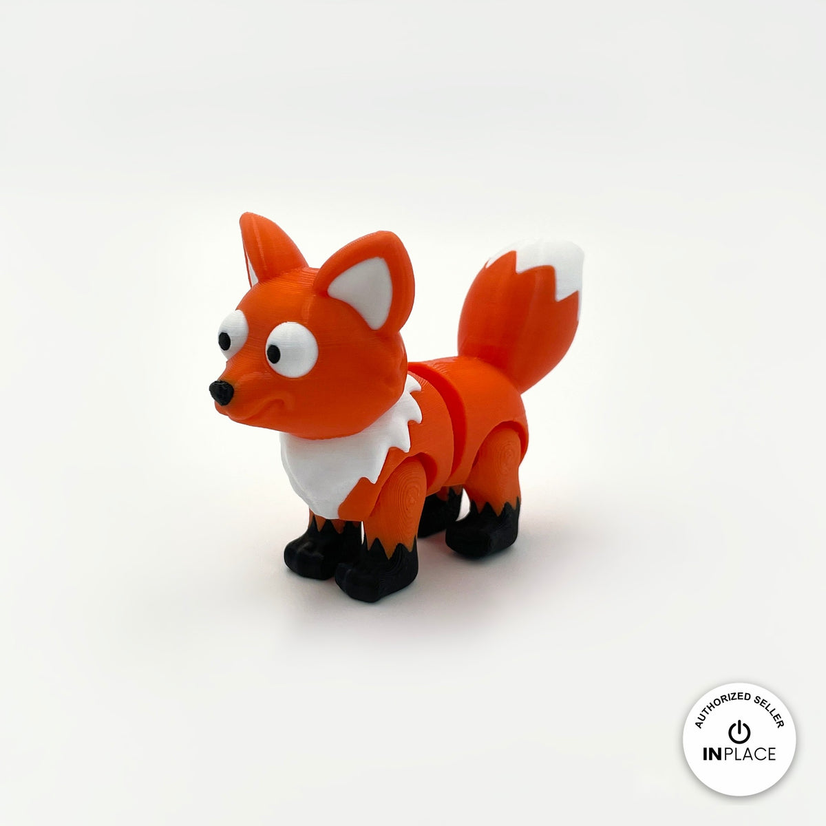 Cute fox keychain, 3D printed by RU3D – three quarter view facing left. Orange with white chest and tail tip.