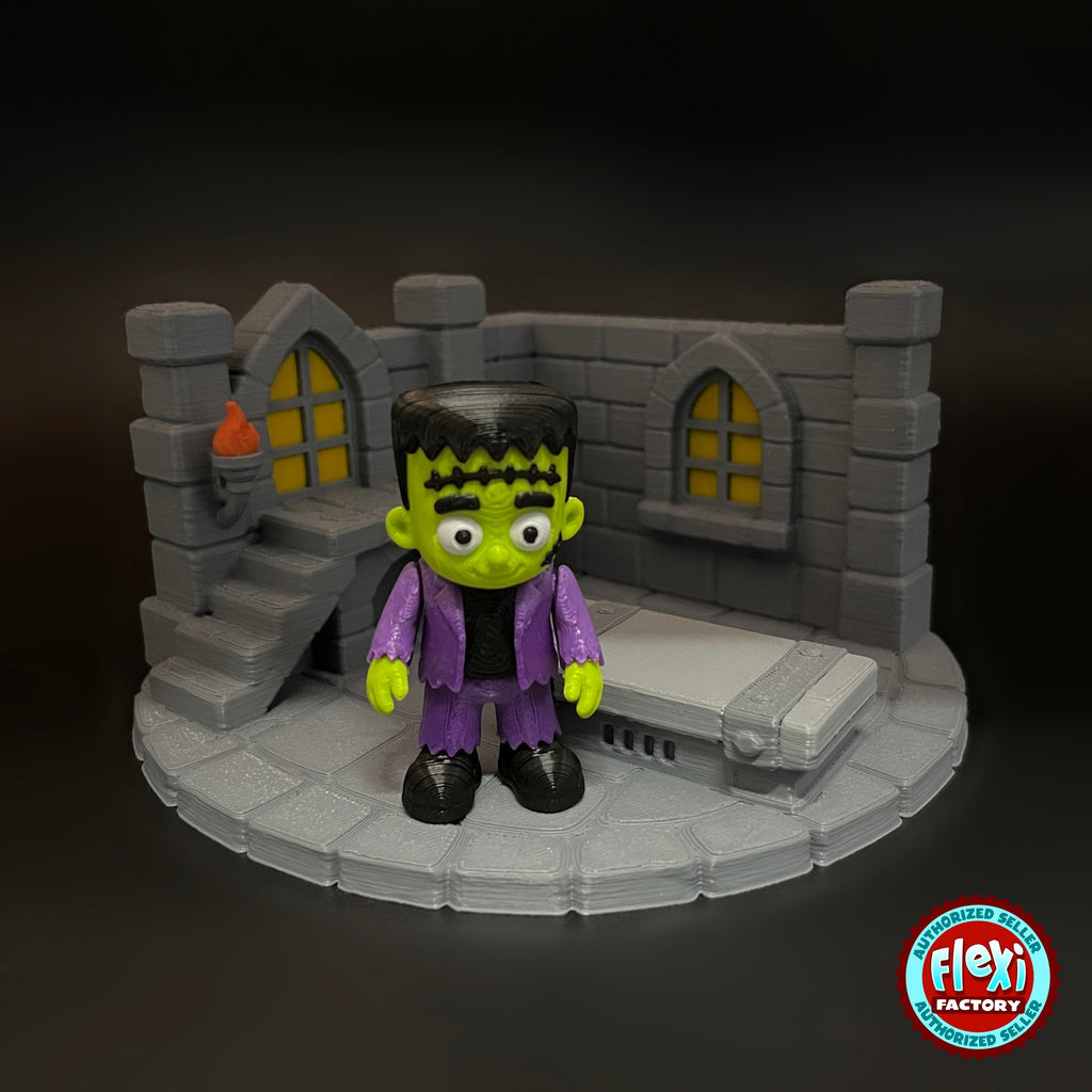 Cute Frankenstein monster keychain, 3D printed by RU3D – front view with laboratory playset. Green skin, purple jacket with laboratory playset.