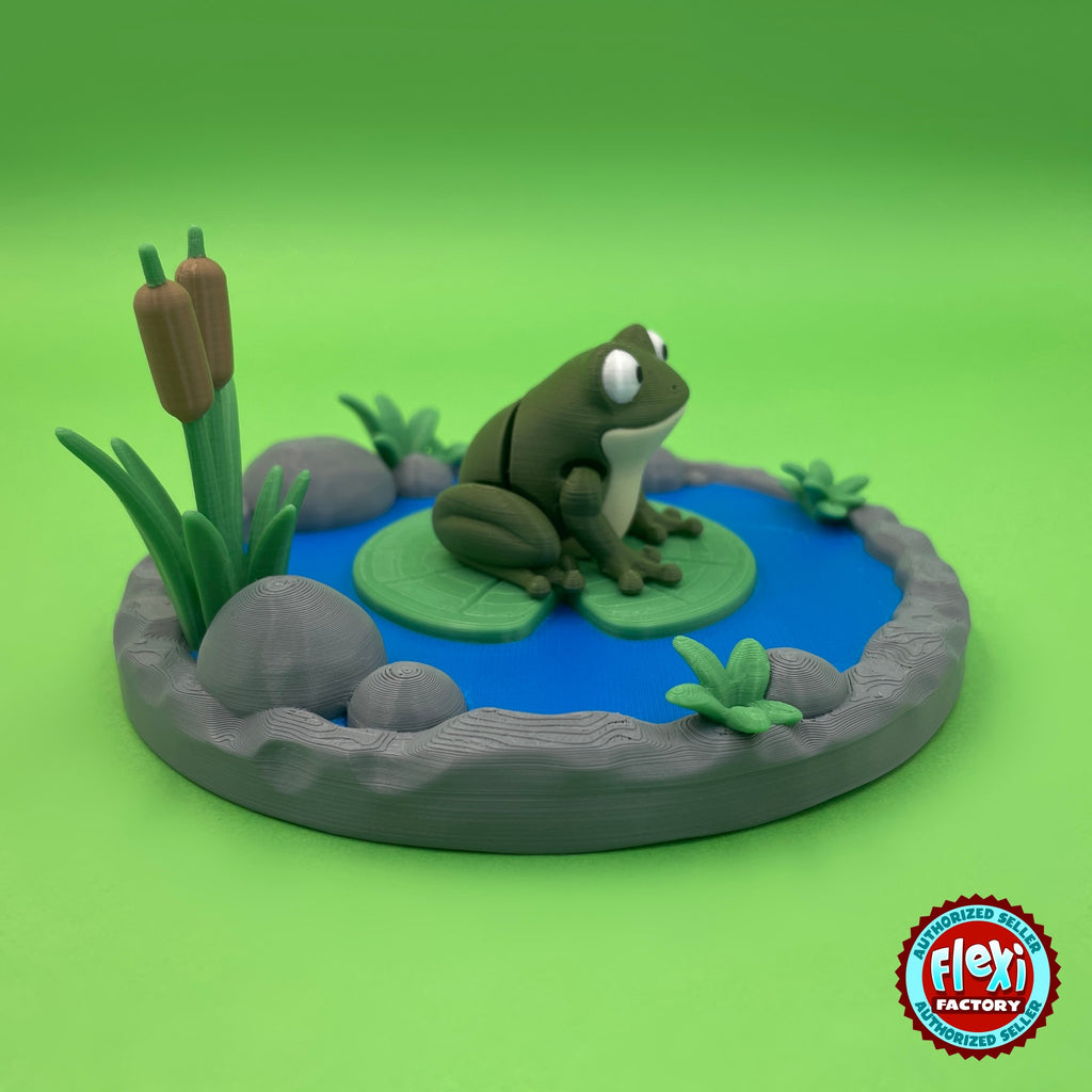 Cute frog keychain, 3D printed by RU3D – side view on pond playset. Olive green with lily pond playset.
