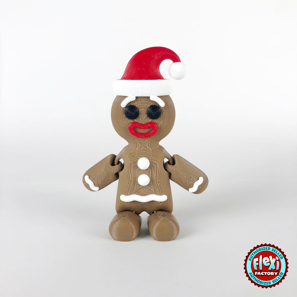 Cute gingerbread man keychain, 3D printed by RU3D – dark eyes with Santa hat front view. Brown with white icing and red Santa hat.