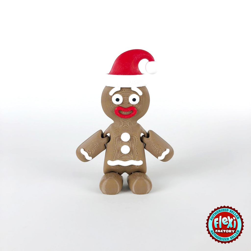 Cute gingerbread man keychain, 3D printed by RU3D – with Santa hat front view. Brown with white icing and red Santa hat.