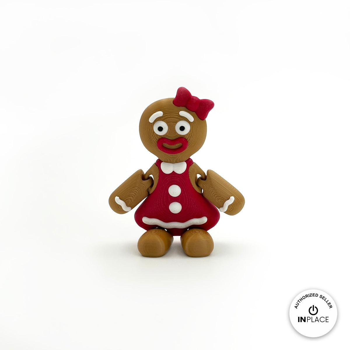 Cute gingerbread woman keychain, 3D printed by RU3D – front view. Brown with red dress and bow.