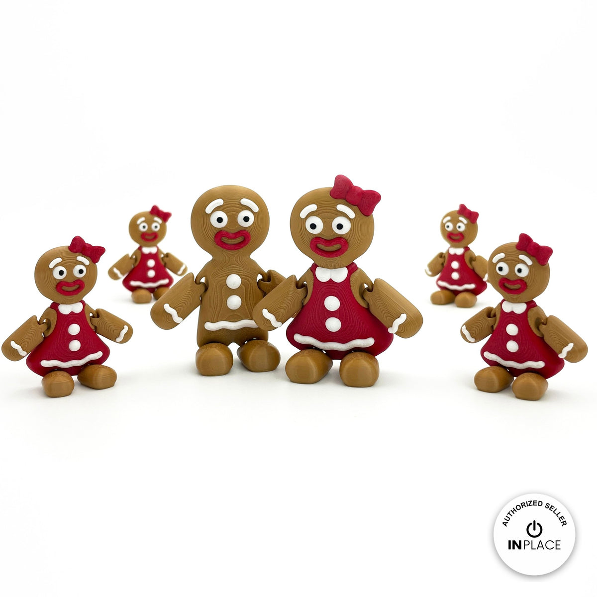 Cute gingerbread woman keychain, 3D printed by RU3D – group with gingerbread man. Brown with red dress and bow.