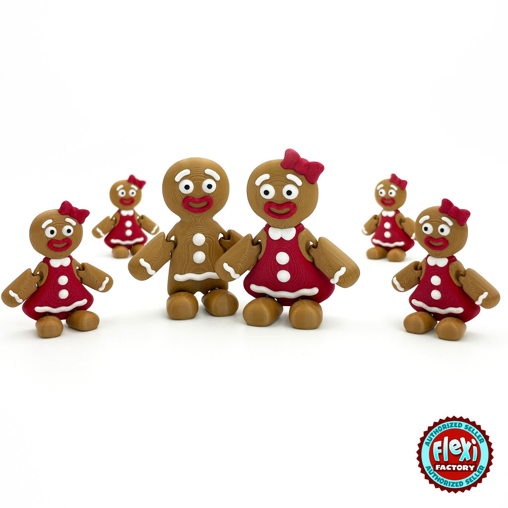 Cute gingerbread woman keychain, 3D printed by RU3D – group with gingerbread man. Brown with red dress and bow.