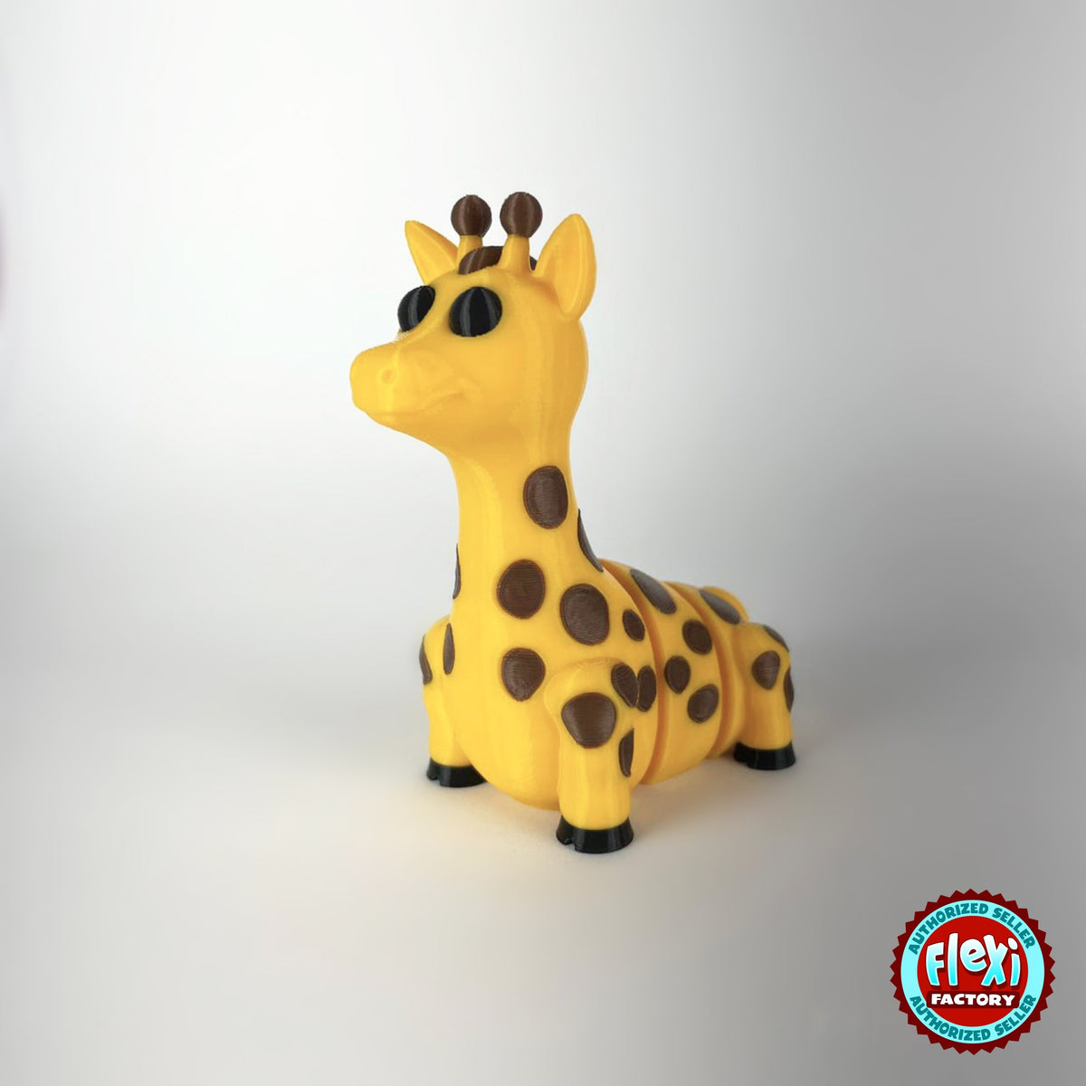 Cute giraffe keychain, 3D printed by RU3D – dark eyes three quarter view facing left. Yellow with brown spots.