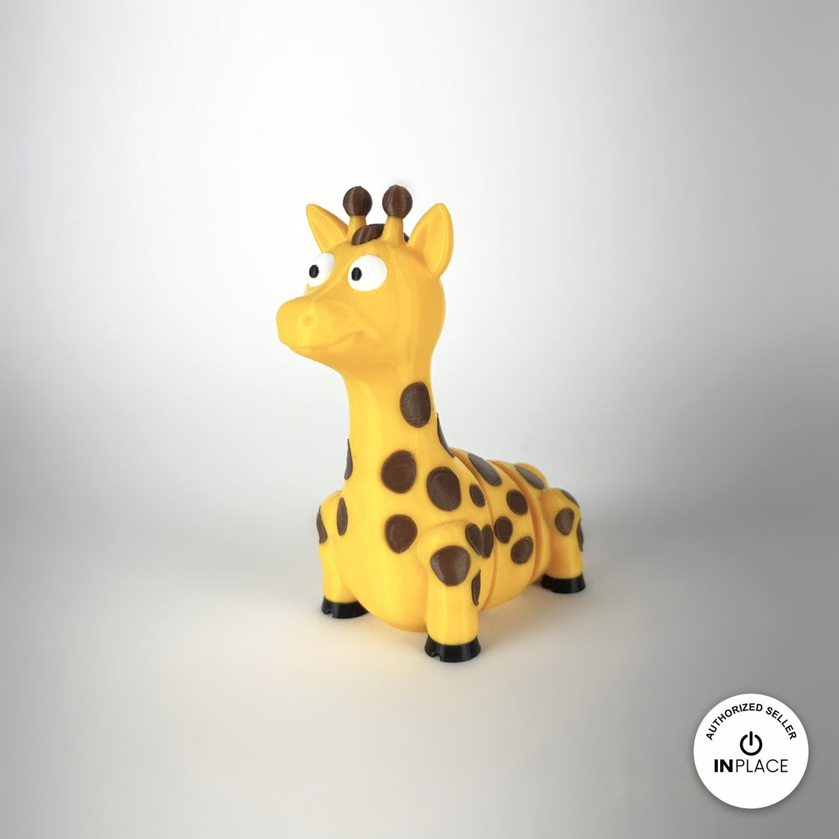 Cute giraffe keychain, 3D printed by RU3D – three quarter view facing left. Yellow with brown spots.