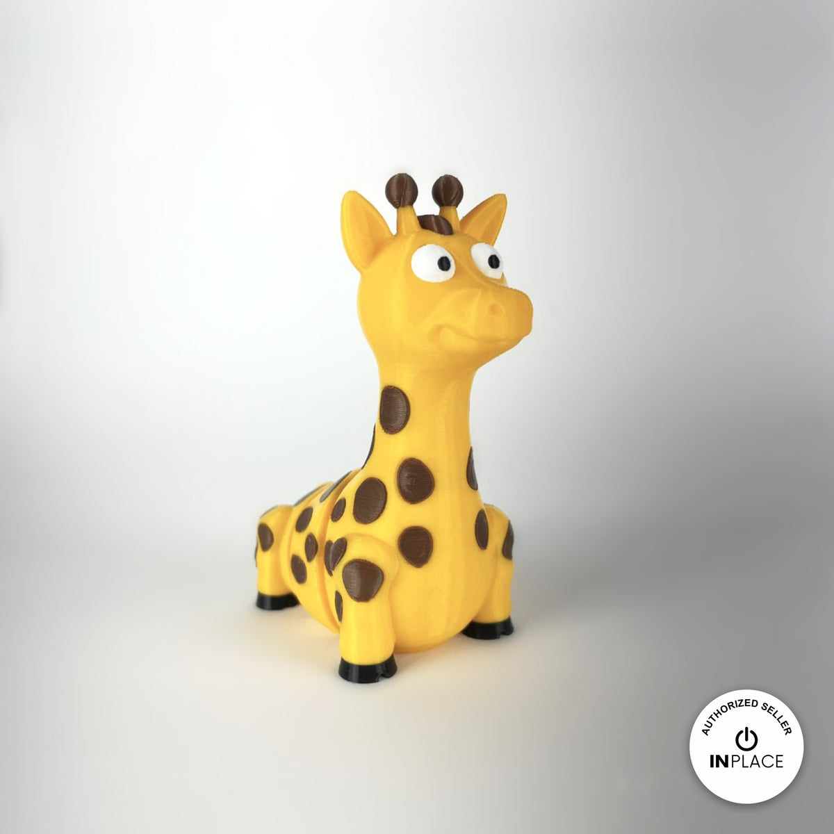 Cute giraffe keychain, 3D printed by RU3D – three quarter view facing right. Yellow with brown spots.