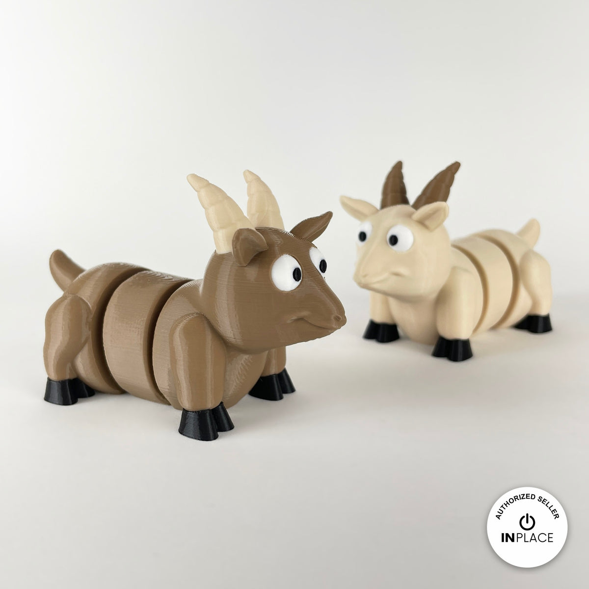 Cute goat keychain, 3D printed by RU3D – brown and cream goats facing right. Brown, cream and white with black hooves.