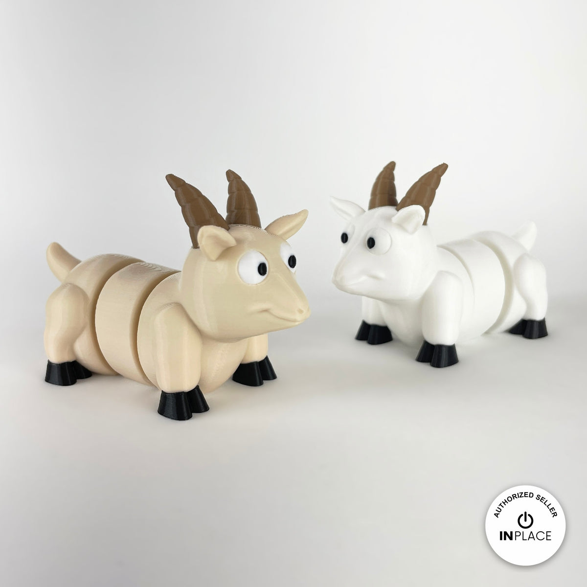 Cute goat keychain, 3D printed by RU3D – cream and white goats facing right. Brown, cream and white with black hooves.