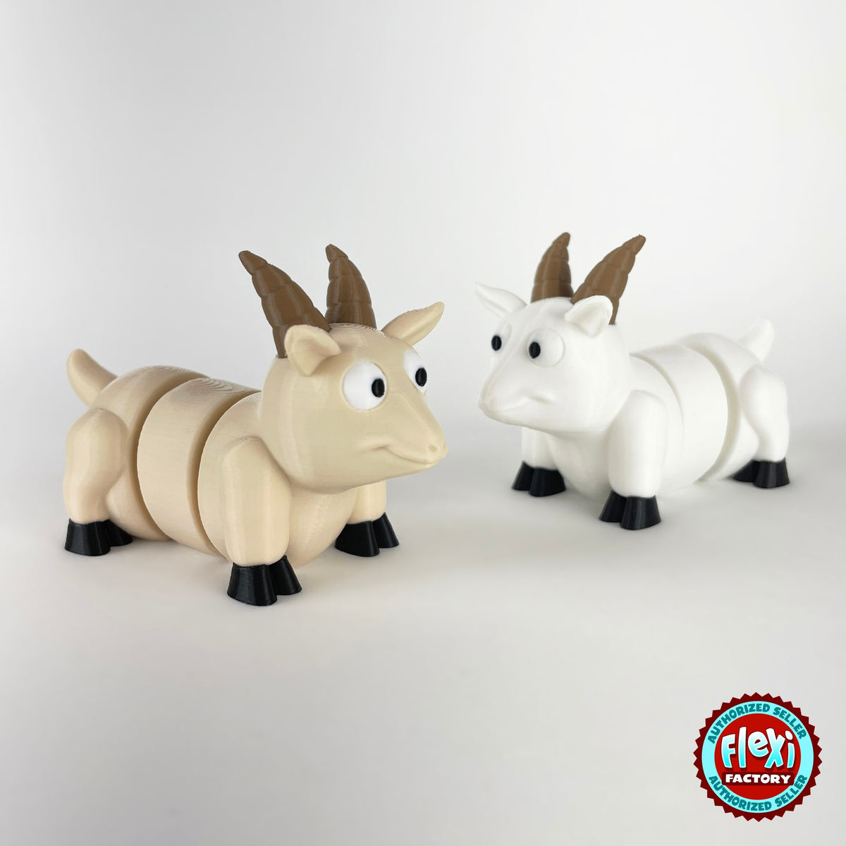 Cute goat keychain, 3D printed by RU3D – cream and white goats facing right. Brown, cream and white with black hooves.