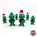 Cute green Christmas grump keychain, 3D printed by RU3D – group of green Christmas grumps. Green with red scarf and Santa hat.
