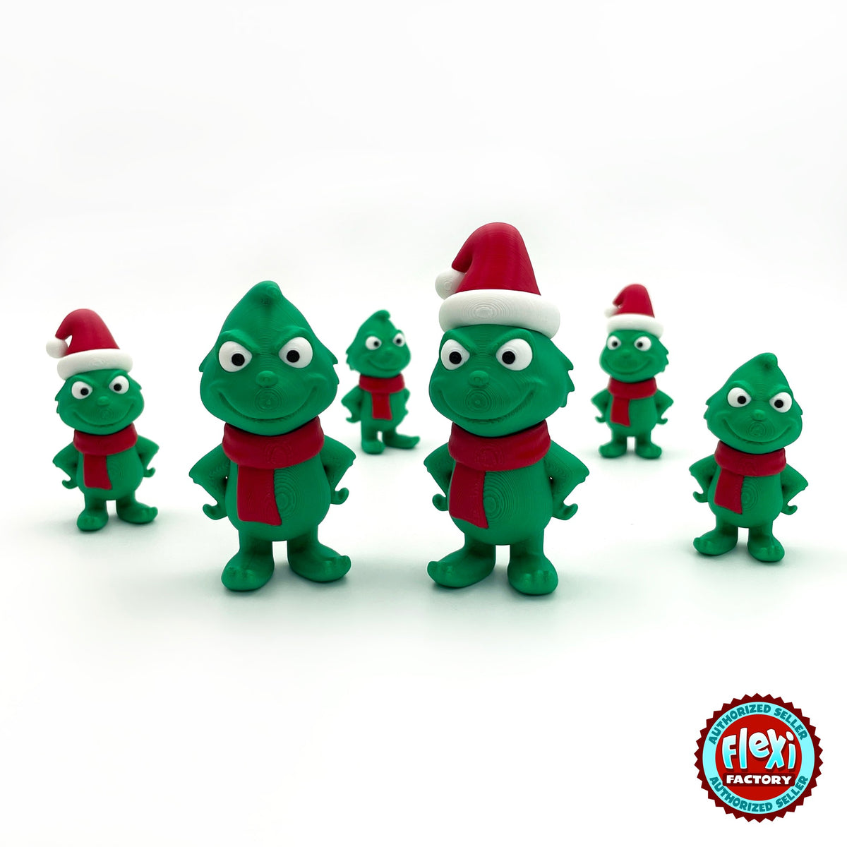 Cute green Christmas grump keychain, 3D printed by RU3D – group of green Christmas grumps. Green with red scarf and Santa hat.