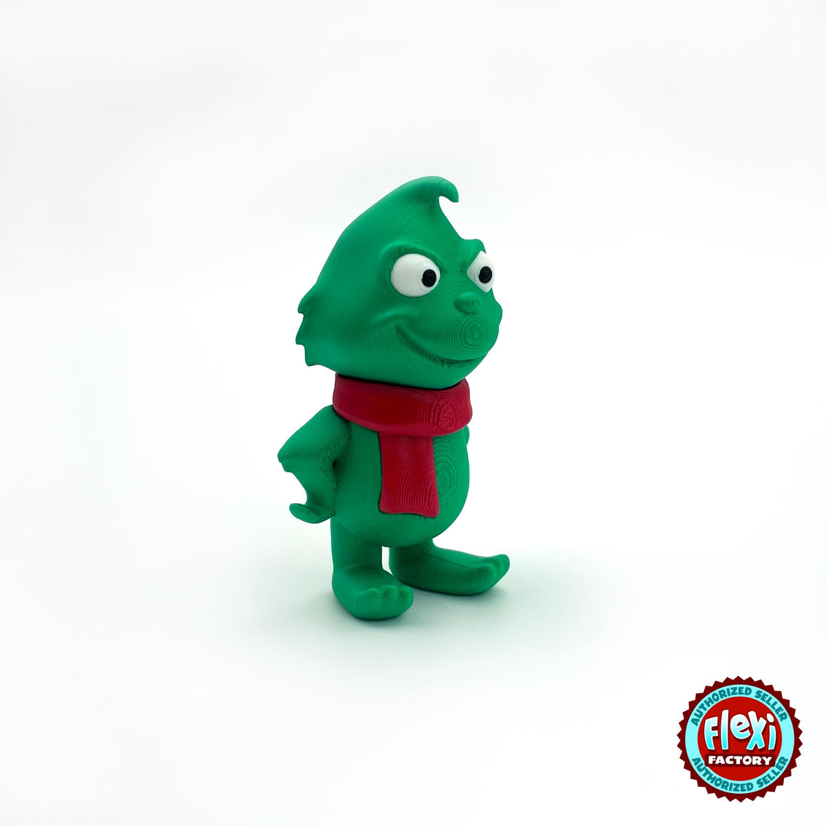 Cute green Christmas grump keychain, 3D printed by RU3D – three quarter view facing right. Green with red scarf and Santa hat.