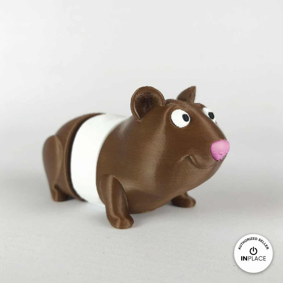 Cute guinea pig keychain, 3D printed by RU3D – brown and white version 2 facing right. Brown with pink nose, also brown and white.