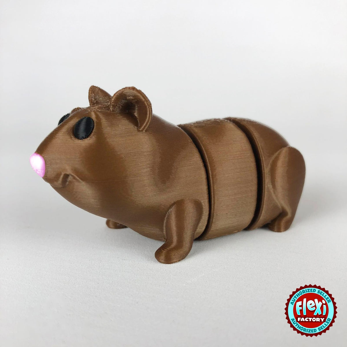 Cute guinea pig keychain, 3D printed by RU3D – dark eyes side view facing left. Brown with pink nose, also brown and white.