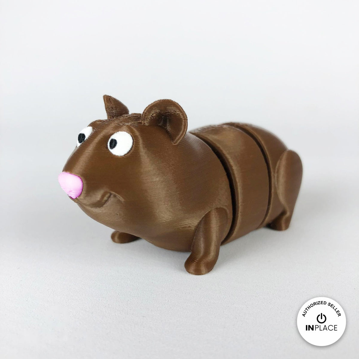 Cute guinea pig keychain, 3D printed by RU3D – three quarter view facing left. Brown with pink nose, also brown and white.