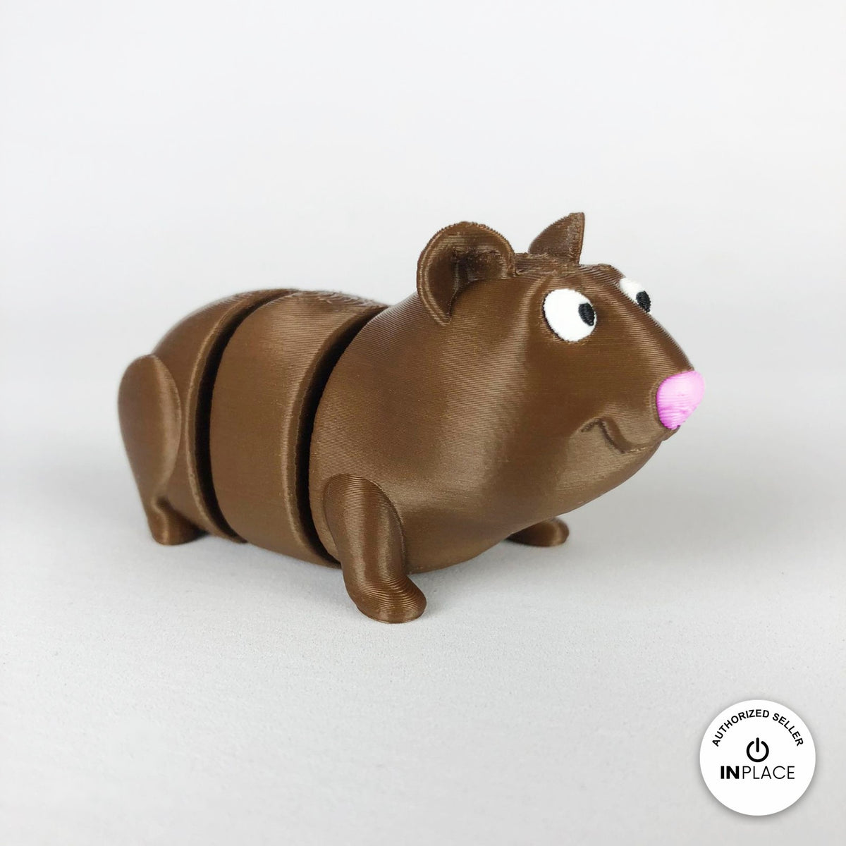 Cute guinea pig keychain, 3D printed by RU3D – three quarter view facing right. Brown with pink nose, also brown and white.