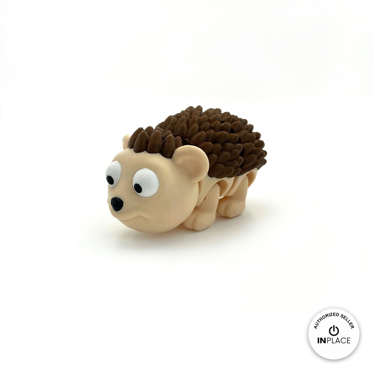 Cute hedgehog keychain, 3D printed by RU3D – close up three quarter view facing left. Cream face with dark brown spikes.