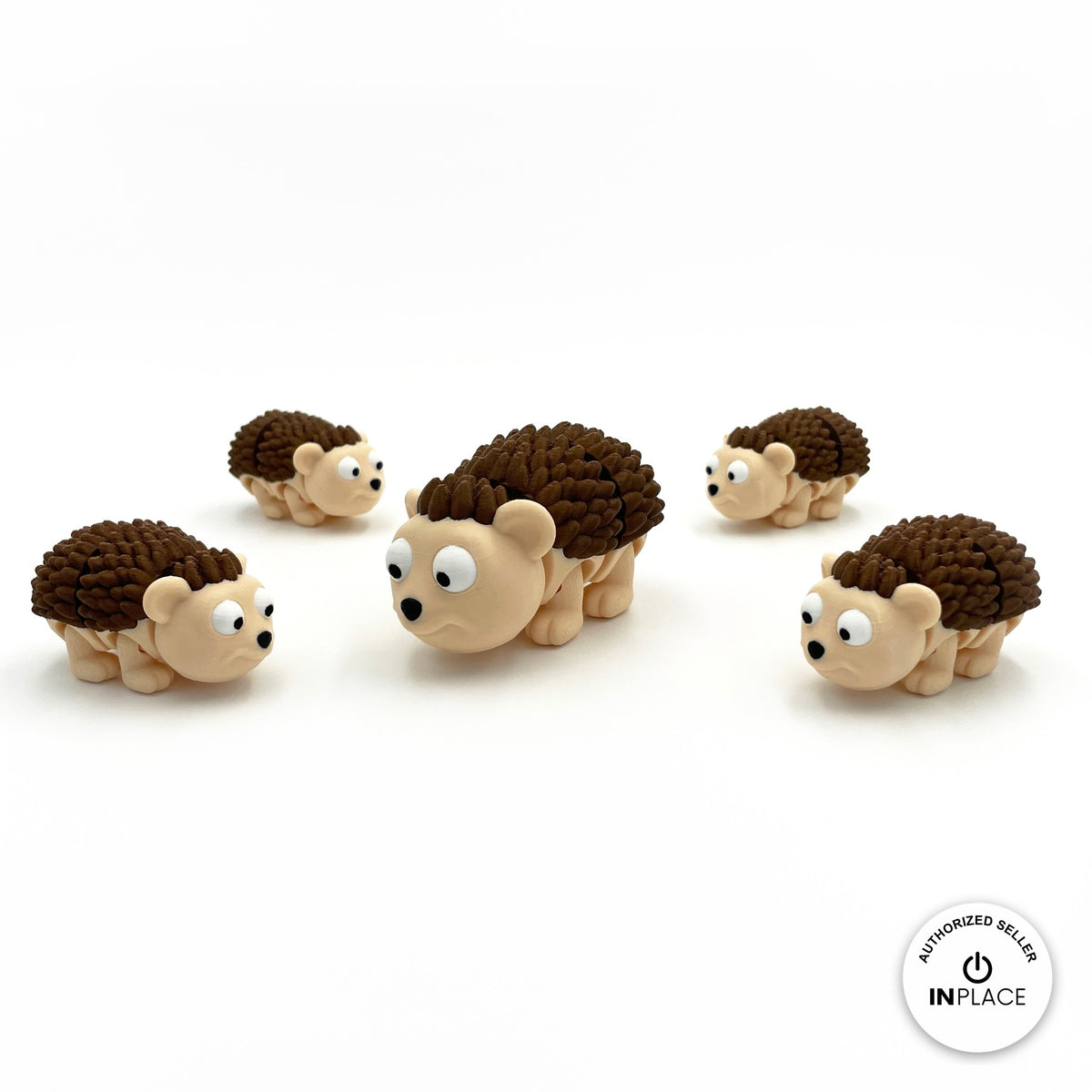 Cute hedgehog keychain, 3D printed by RU3D – group of hedgehogs. Cream face with dark brown spikes.