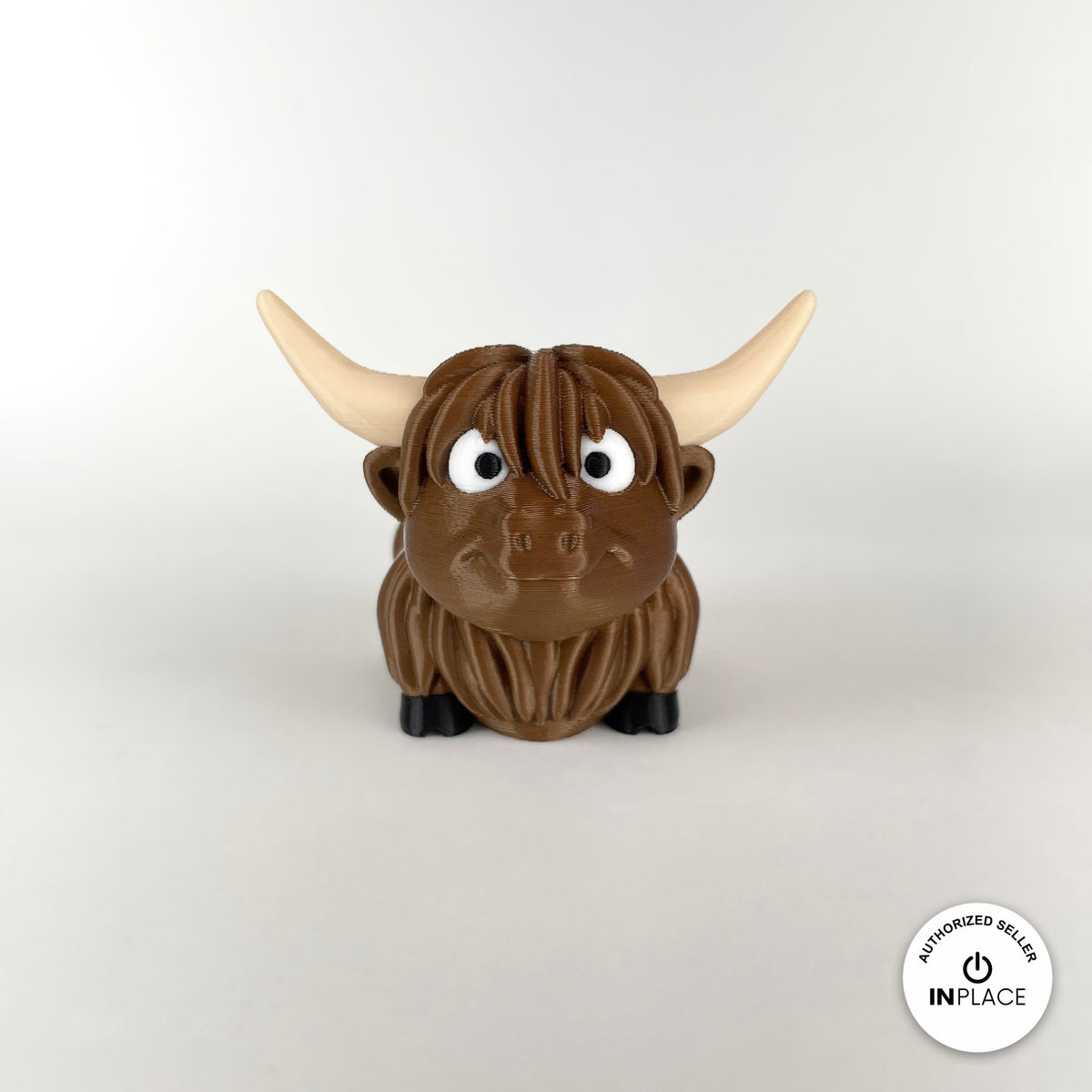 Cute Highland cow keychain, 3D printed by RU3D – front view no muzzle. Shaggy brown with cream horns.