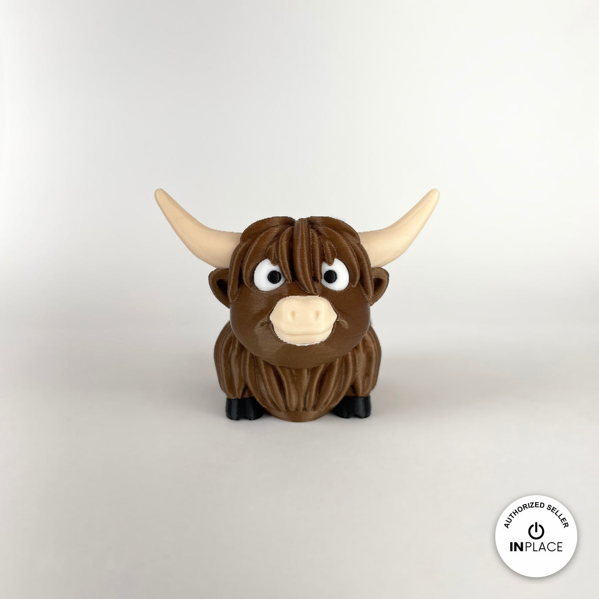 Cute Highland cow keychain, 3D printed by RU3D – front view. Shaggy brown with cream horns.