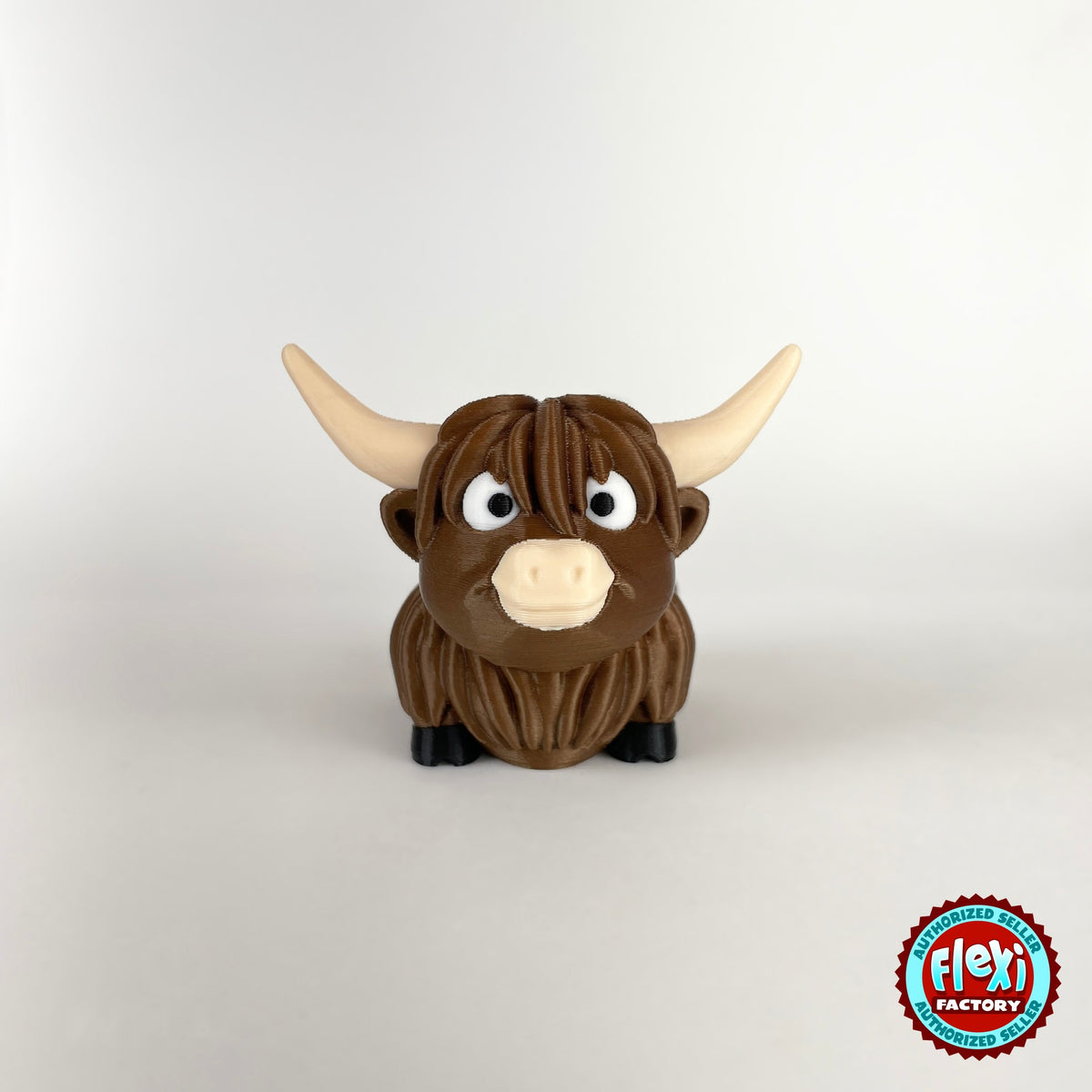 Cute Highland cow keychain, 3D printed by RU3D – front view. Shaggy brown with cream horns.
