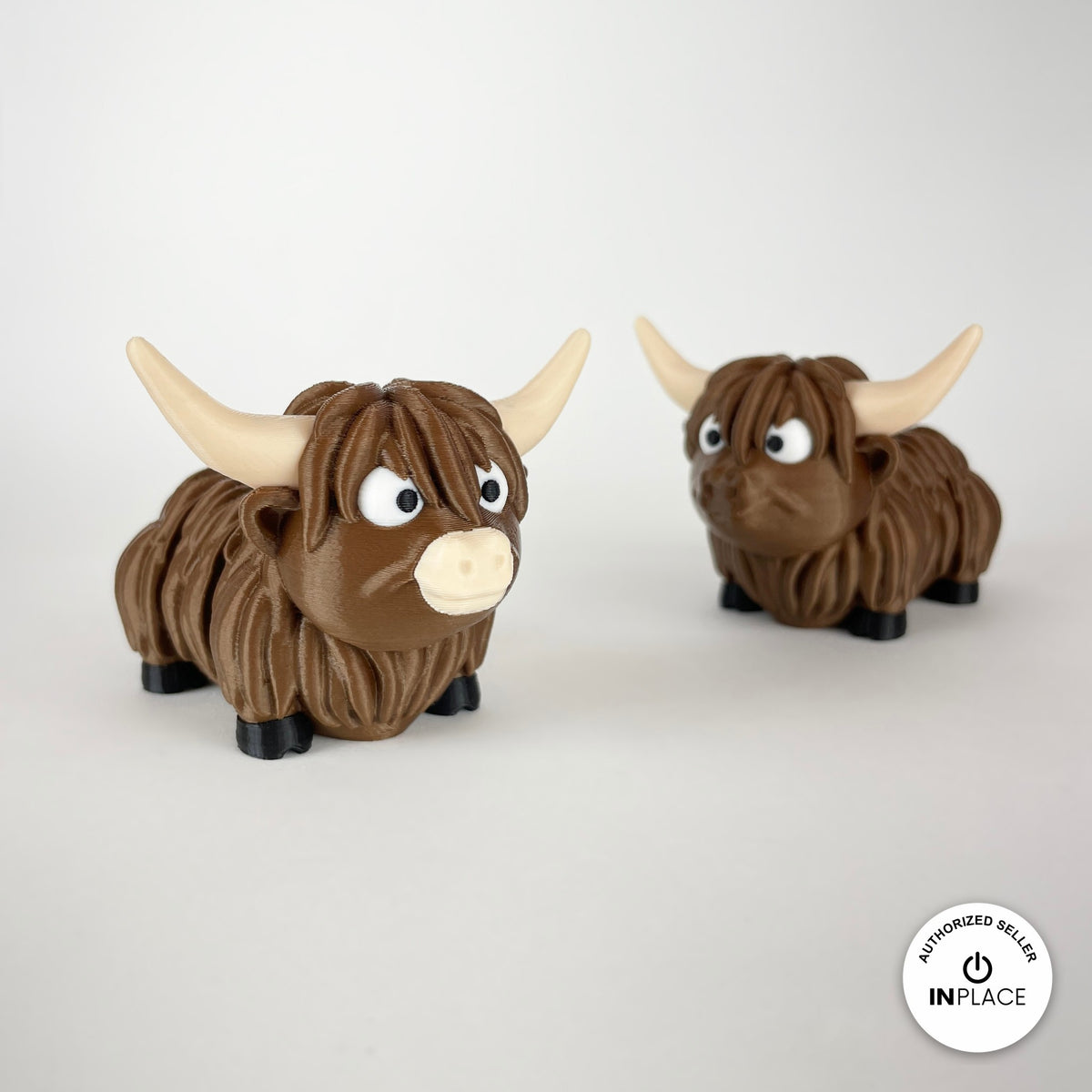 Cute Highland cow keychain, 3D printed by RU3D – pair of Highland cows. Shaggy brown with cream horns.