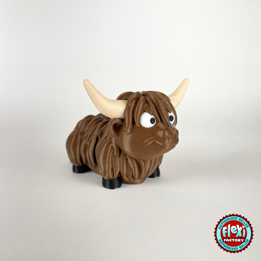 Cute Highland cow keychain, 3D printed by RU3D – three quarter view facing right looking up. Shaggy brown with cream horns.