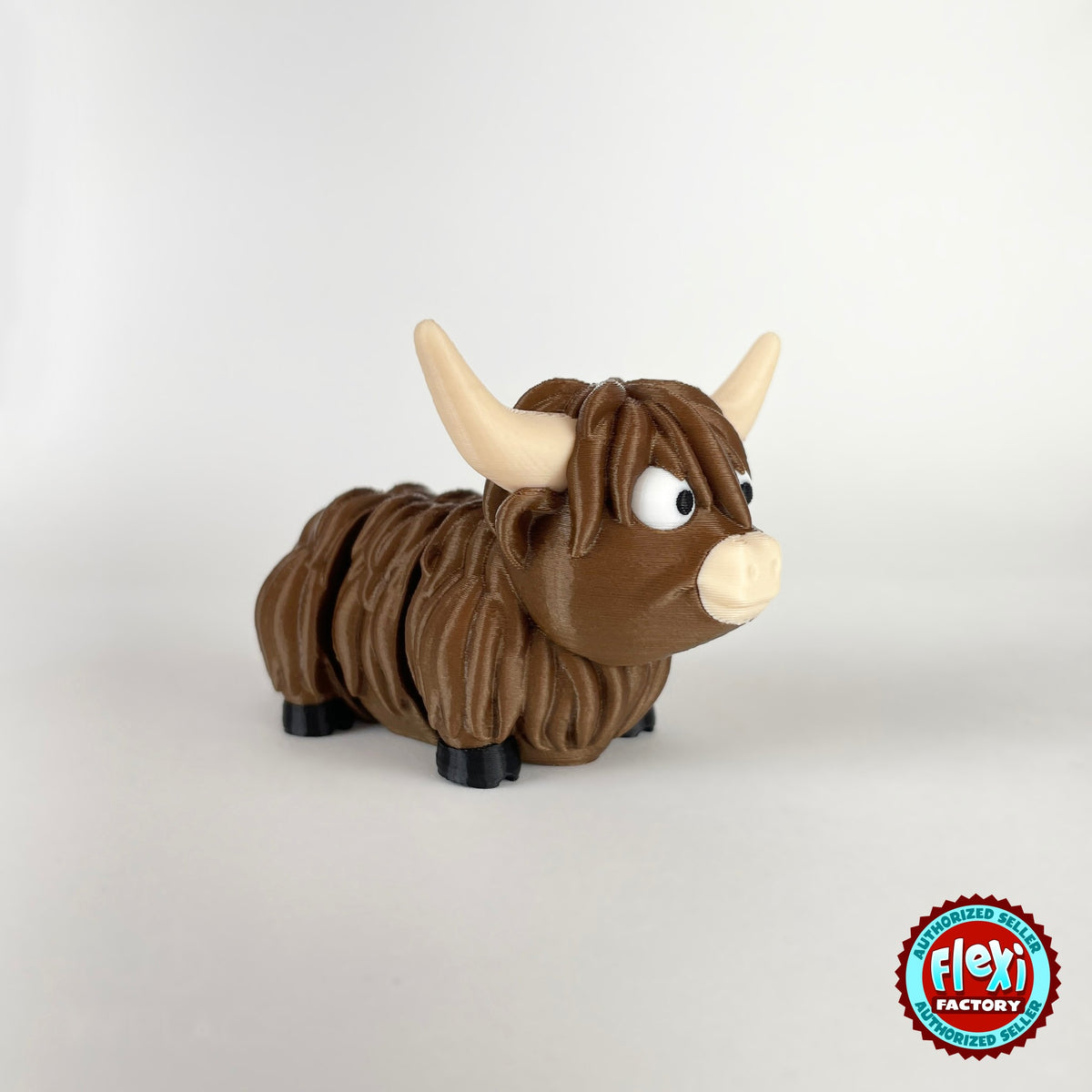Cute Highland cow keychain, 3D printed by RU3D – three quarter view facing right. Shaggy brown with cream horns.
