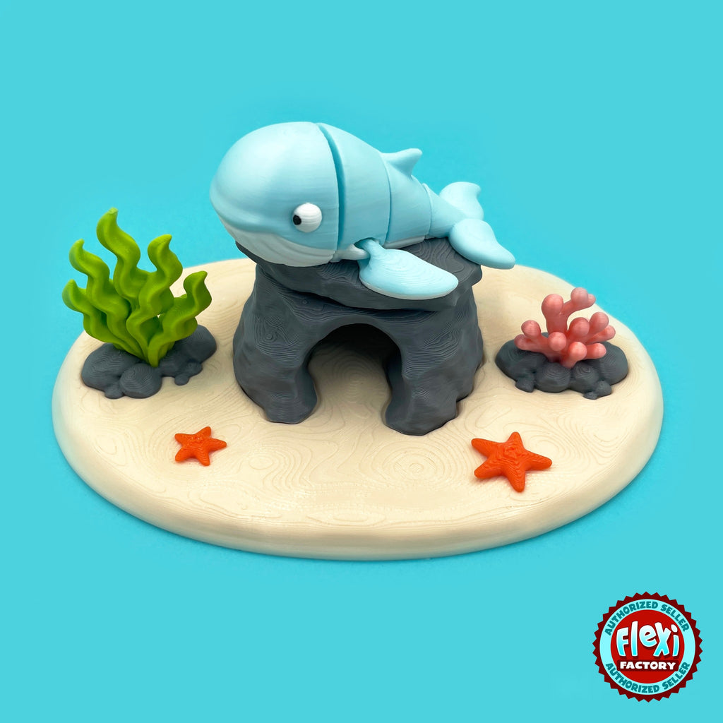 Cute humpback whale keychain, 3D printed by RU3D – three quarter view on reef playset. Light blue with ocean reef playset.