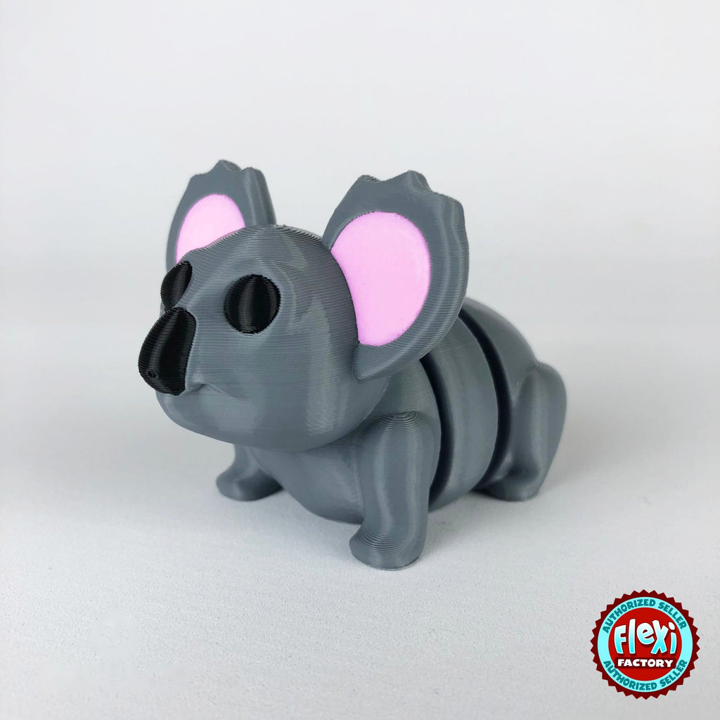 Cute koala keychain, 3D printed by RU3D – dark eyes three quarter view facing left. Grey with pink ears.