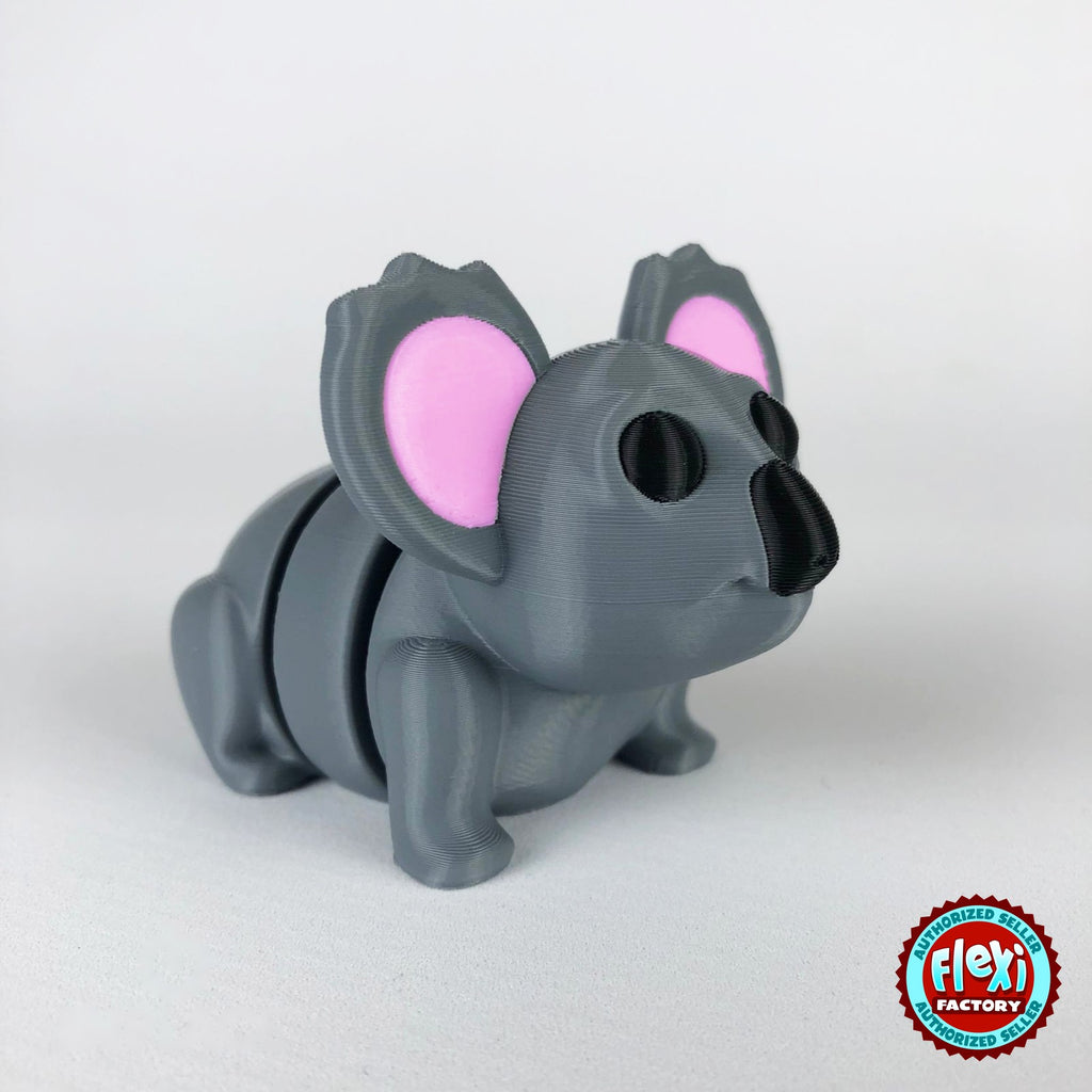 Cute koala keychain, 3D printed by RU3D – dark eyes three quarter view facing right. Grey with pink ears.