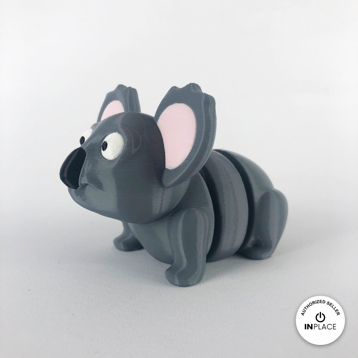 Cute koala keychain, 3D printed by RU3D – three quarter view facing left. Grey with pink ears.