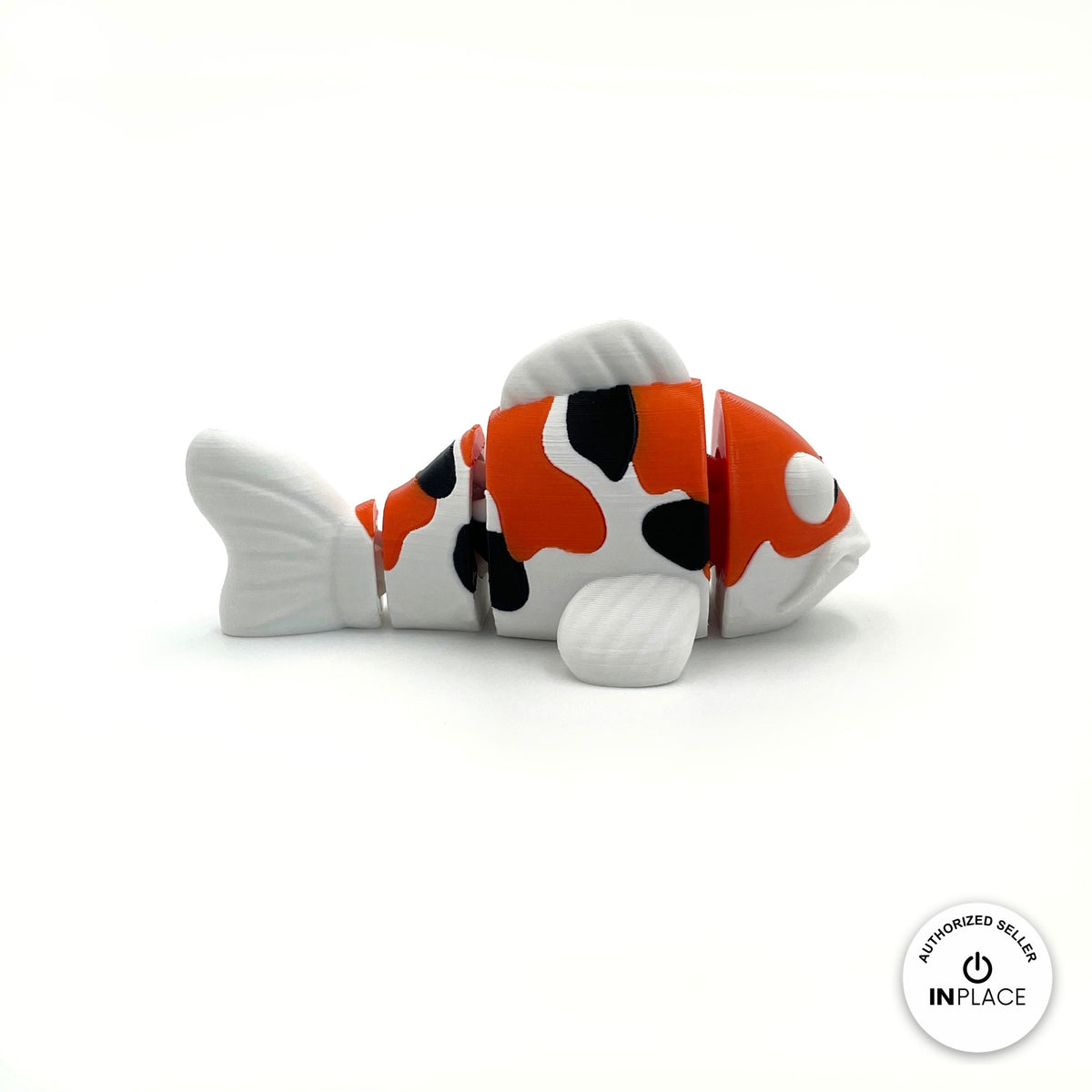 Cute koi fish keychain, 3D printed by RU3D – side view facing right. Orange, white and black, also in solid orange.