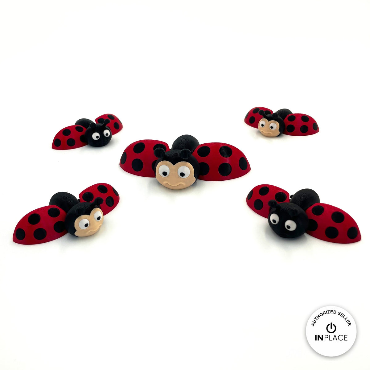 Cute ladybug keychain, 3D printed by RU3D – group of ladybugs wings open. Red with black spots.