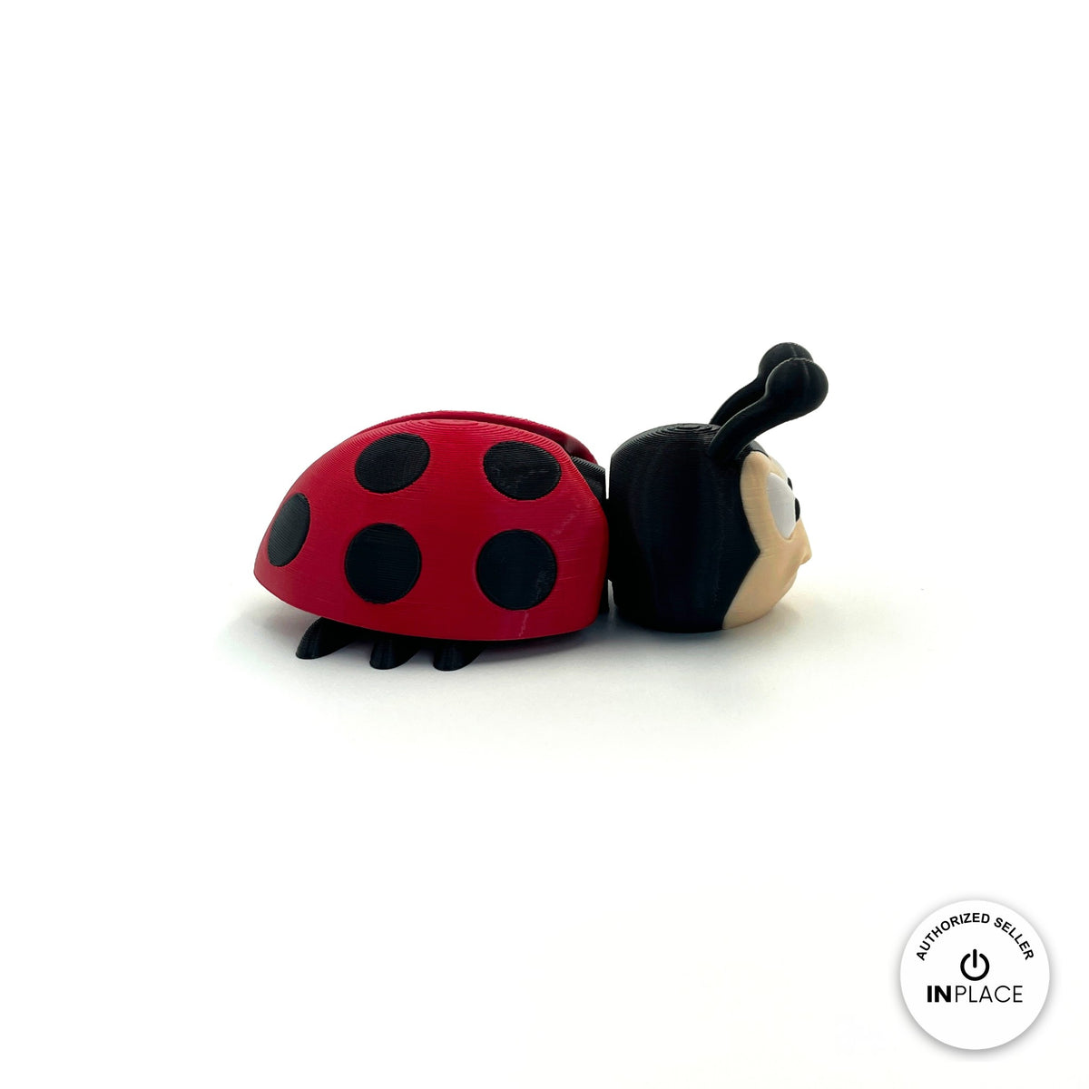 Cute ladybug keychain, 3D printed by RU3D – side view facing right. Red with black spots.