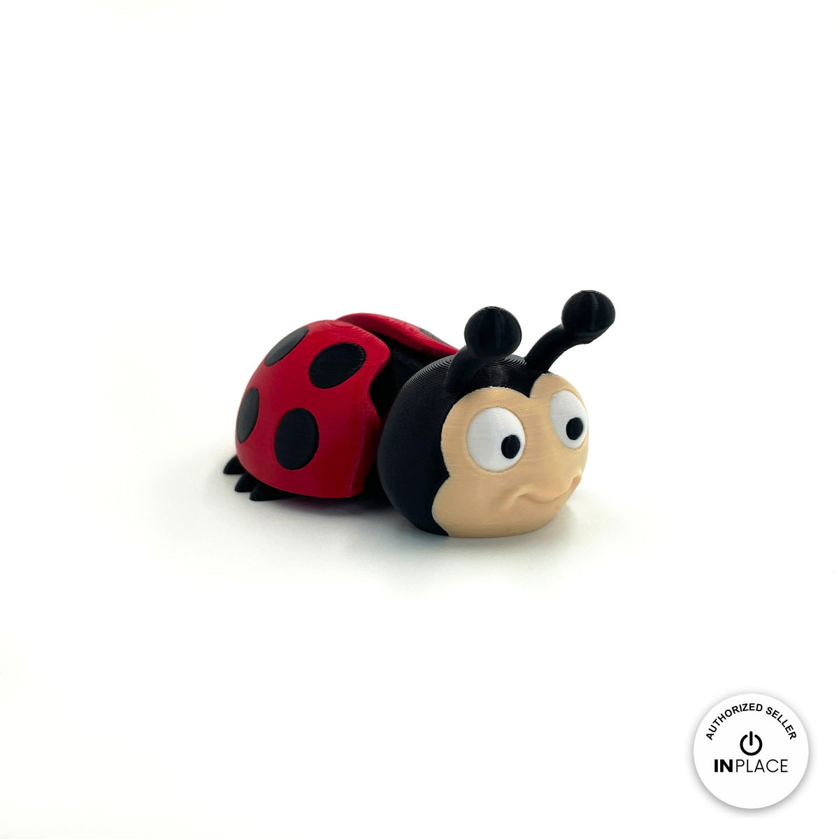 Cute ladybug keychain, 3D printed by RU3D – three quarter view facing right. Red with black spots.