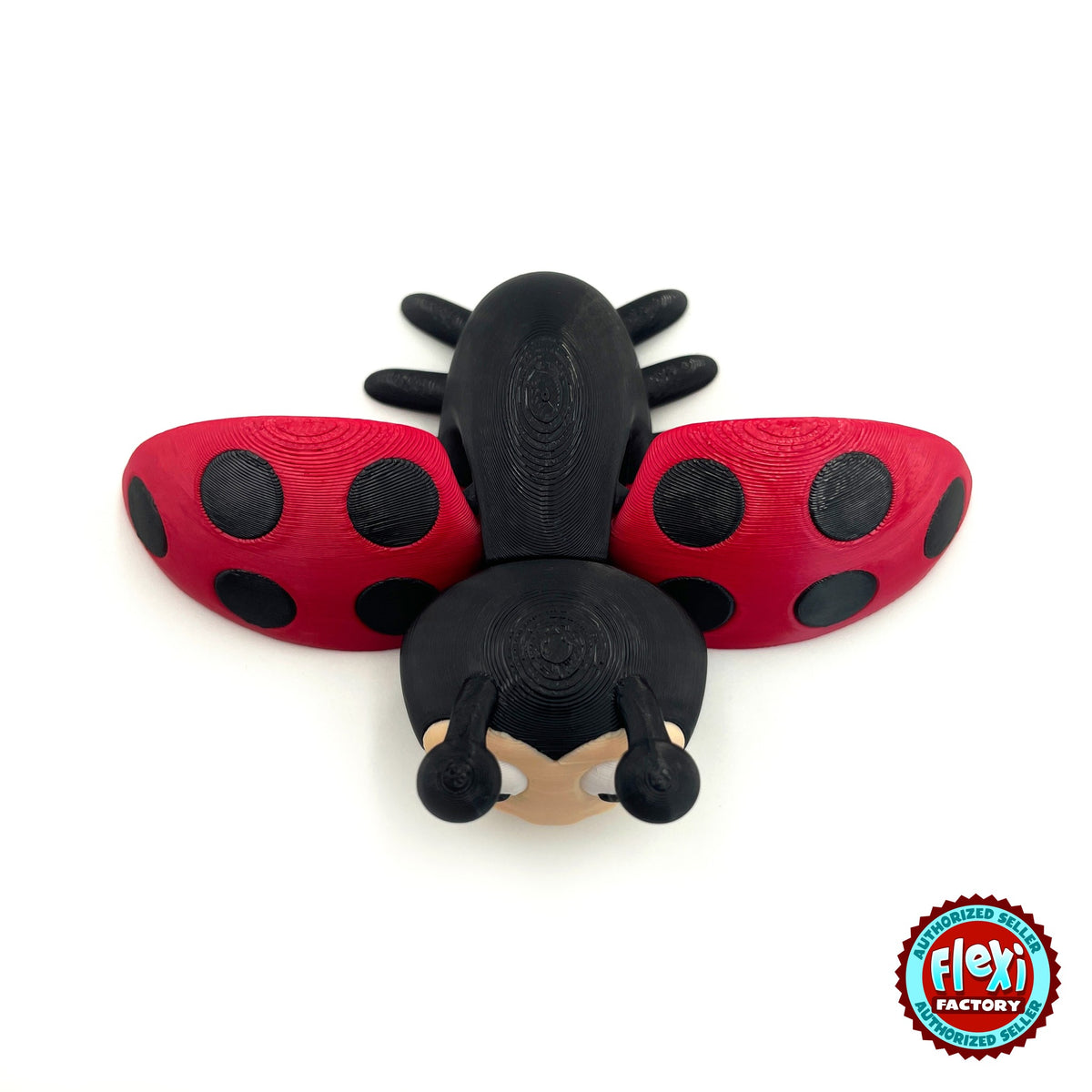Cute ladybug keychain, 3D printed by RU3D – top view wings open. Red with black spots.