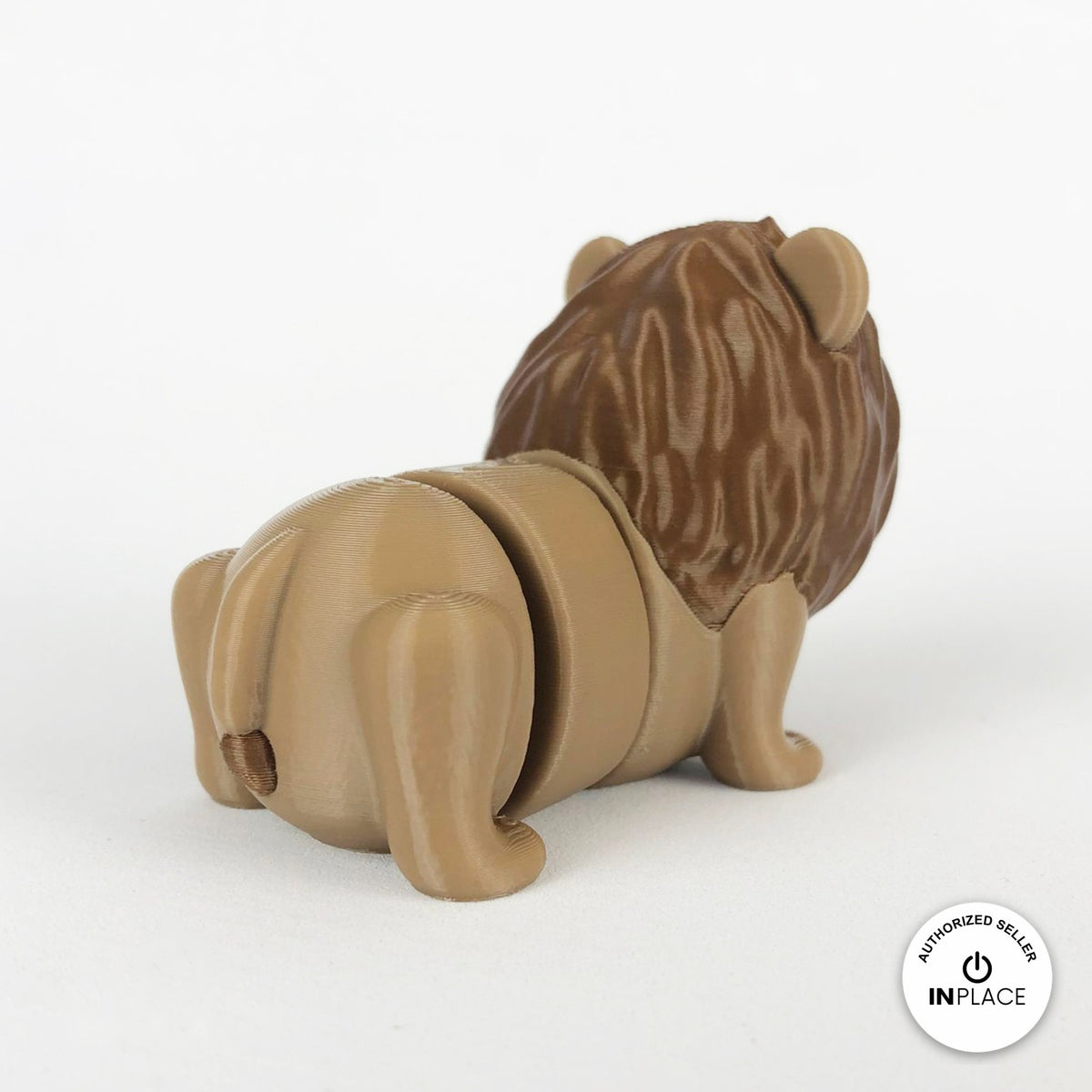 Cute lion keychain, 3D printed by RU3D – rear three quarter view. Tan with brown mane.