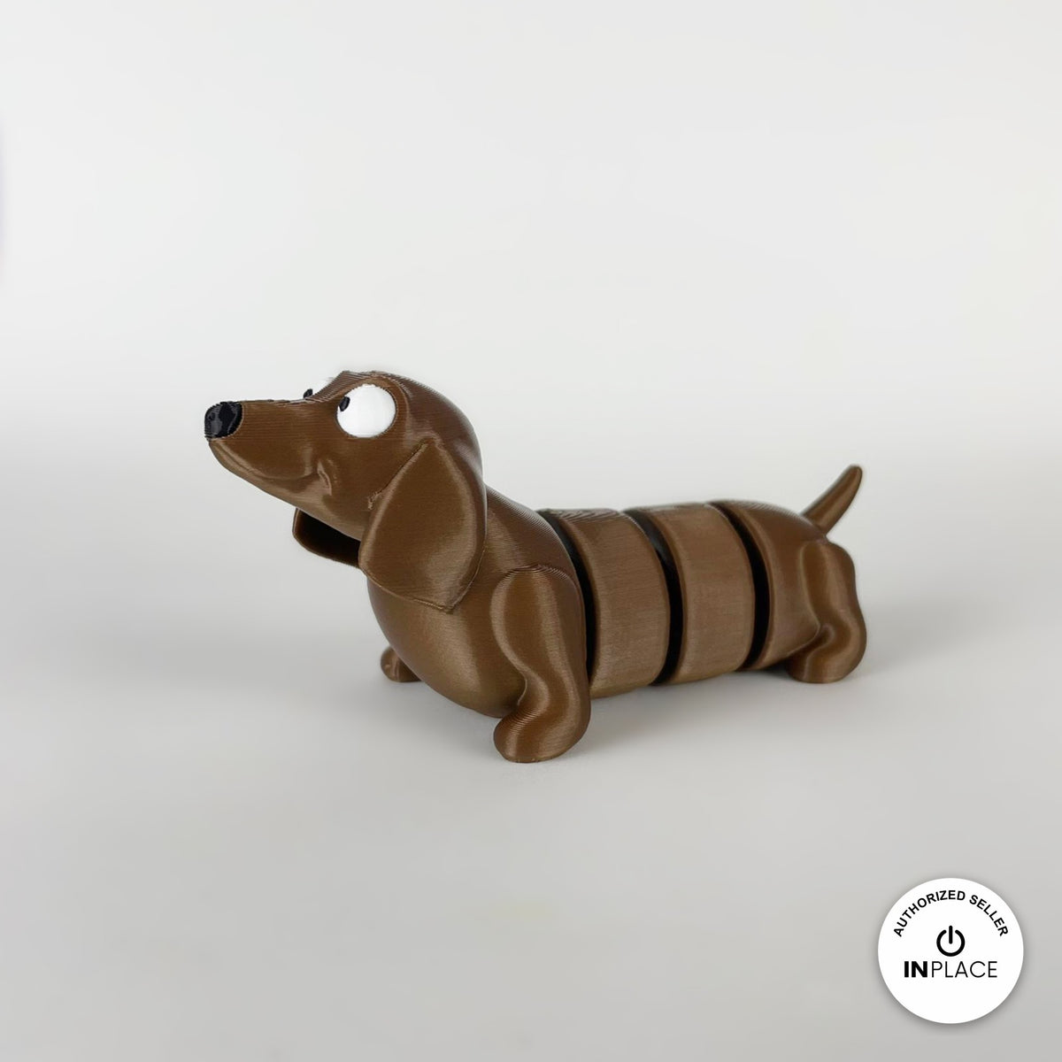 Cute long dachshund sausage dog keychain, 3D printed by RU3D – three quarter view facing left. Brown, extra-long body.