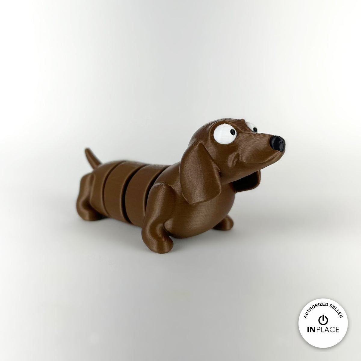 Cute long dachshund sausage dog keychain, 3D printed by RU3D – three quarter view facing right. Brown, extra-long body.