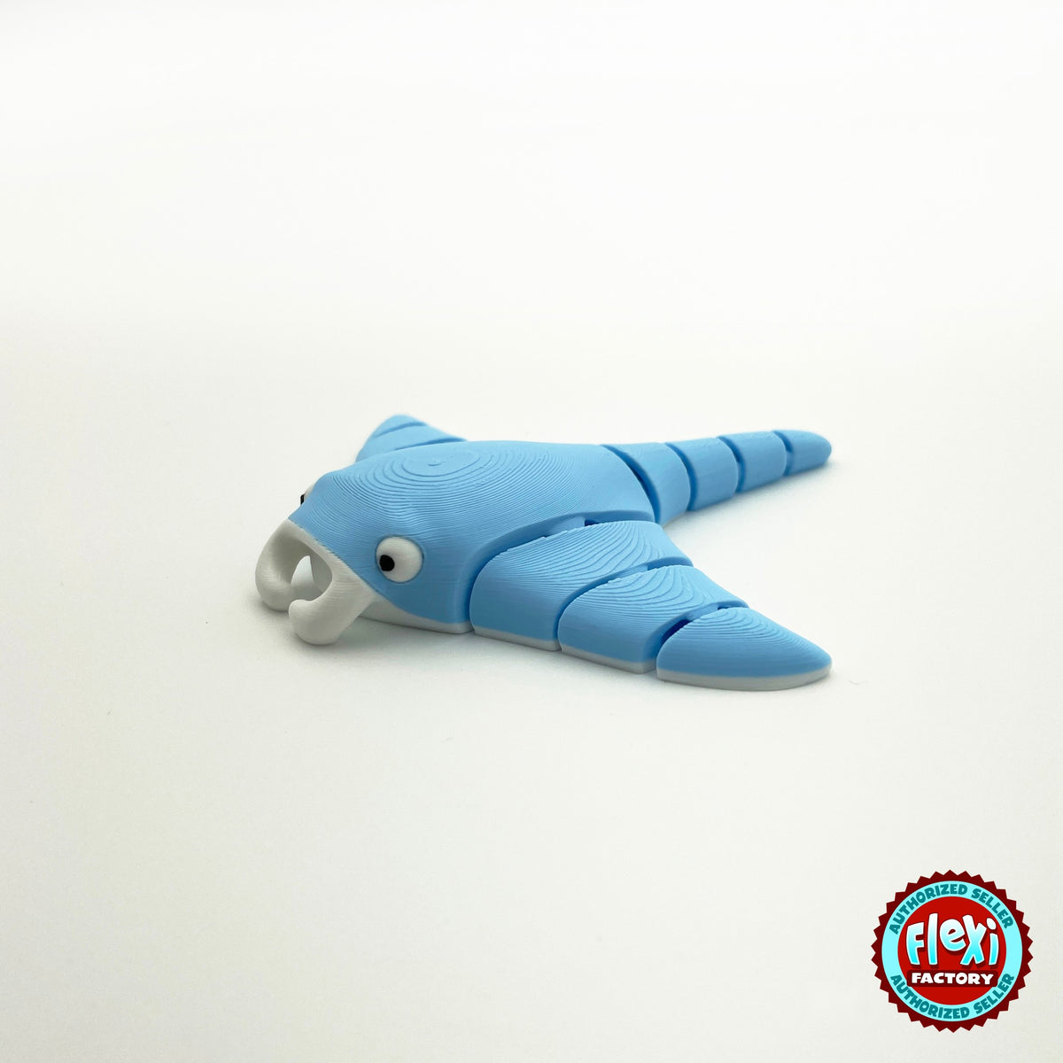Cute manta ray keychain, 3D printed by RU3D – blue three quarter view facing left. Light blue, also in grey.