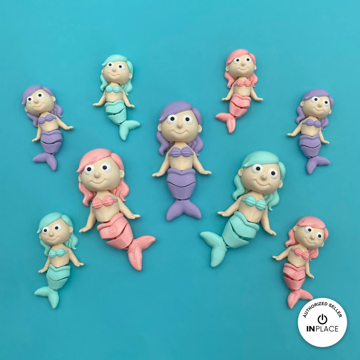 Cute mermaid keychain, 3D printed by RU3D – group of pastel mermaids. Pastel pink, purple and teal tails.