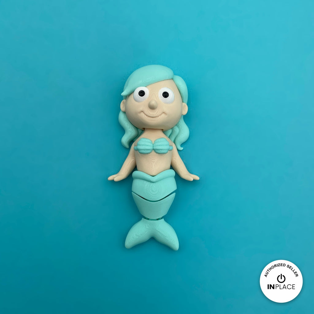 Cute mermaid keychain, 3D printed by RU3D – teal mermaid front view. Pastel pink, purple and teal tails.
