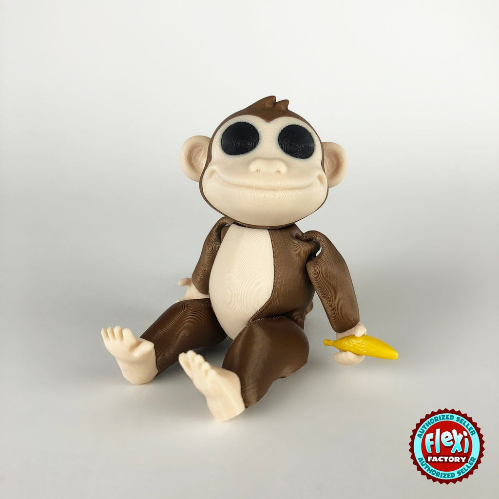 Cute monkey keychain, 3D printed by RU3D – dark eyes sitting with banana. Brown with cream face and yellow banana.