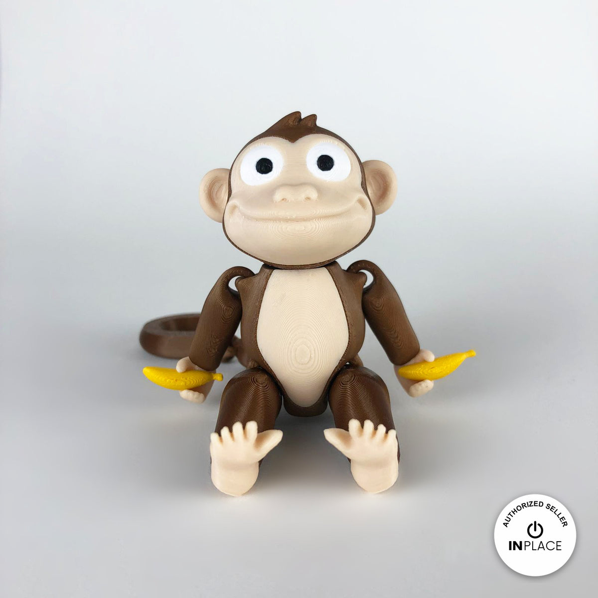 3D printed banana accessory by RU3D, shown with the Monkey keychain