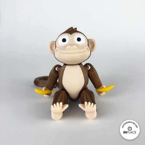 3D printed banana accessory by RU3D, shown with the Monkey keychain