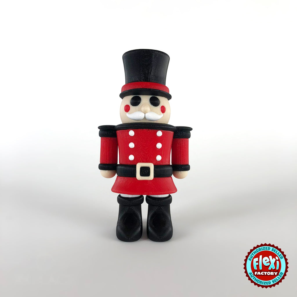 Cute nutcracker soldier keychain, 3D printed by RU3D – dark eyes front view. Red jacket with black top hat and boots.