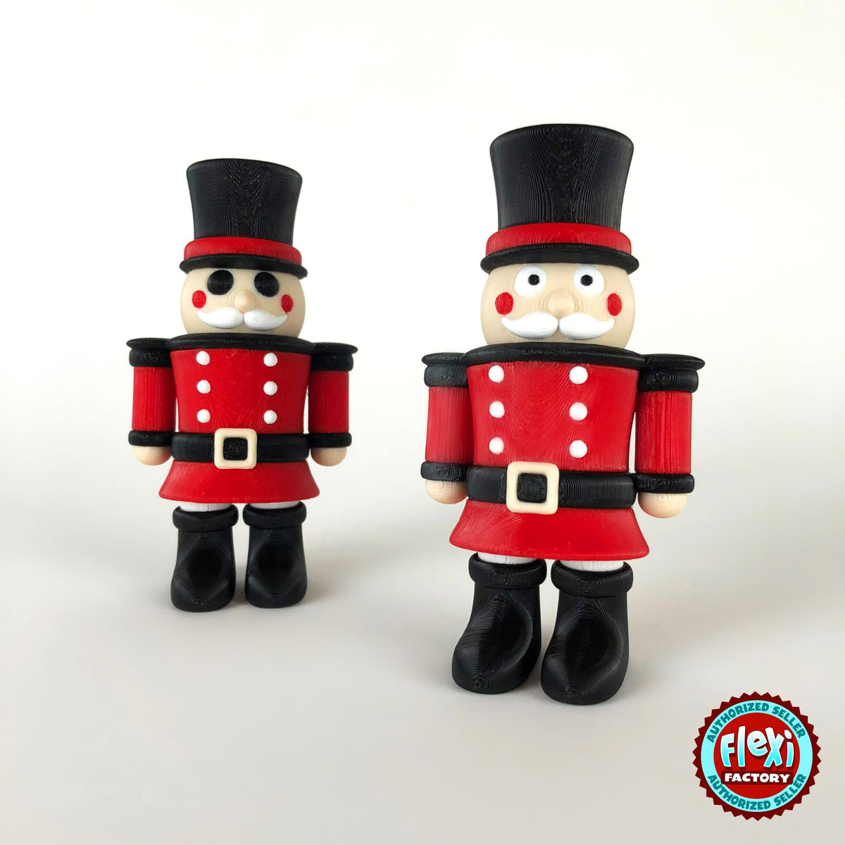 Cute nutcracker soldier keychain, 3D printed by RU3D – pair of nutcrackers. Red jacket with black top hat and boots.