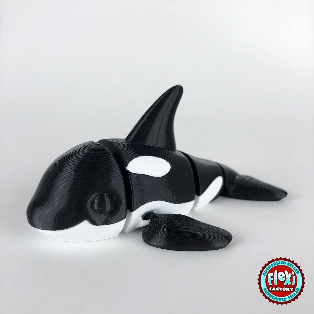 Cute orca killer whale keychain, 3D printed by RU3D – dark eyes three quarter view facing left. Black and white.